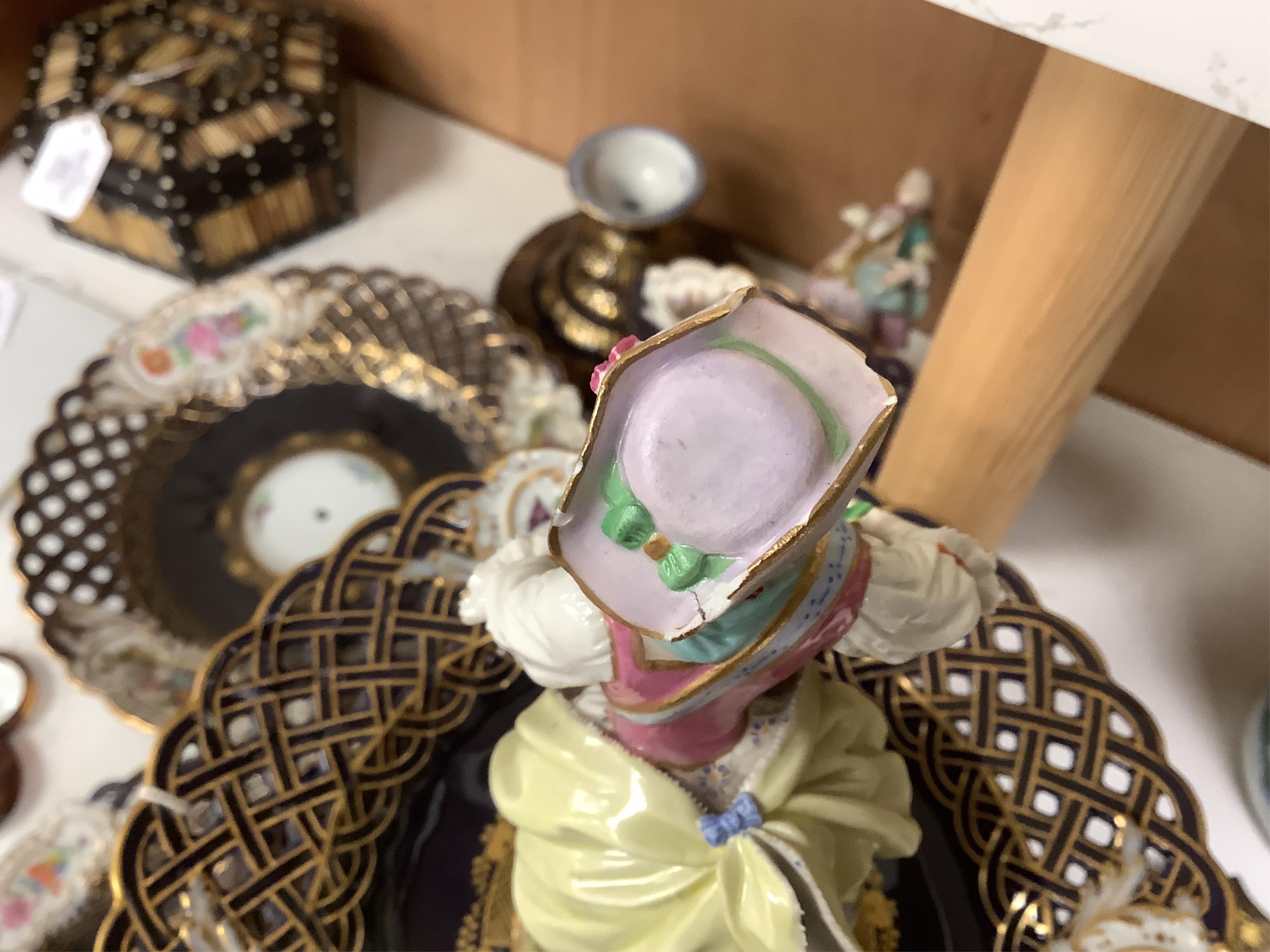 A pair of late 19th century Meissen three tier cake stands with figural tops, 48cm high